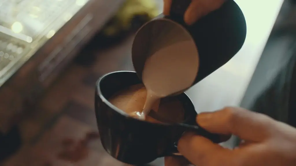 Pouring milk into a coffee